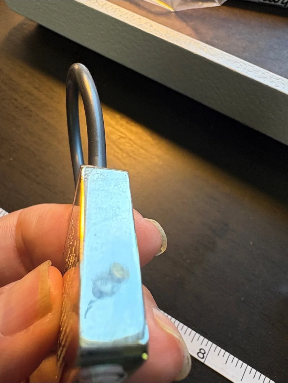 Coach Silver Creed Keychain with Black Pen.